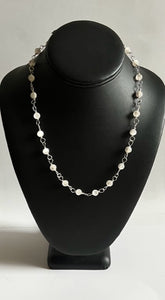 19 1/2 inch sterling silver wire wrapped antique bead necklace with a 3 inch drop. Enjoy!