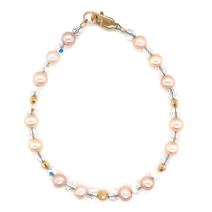 14 karat gold beads with soft toned freshwater pearls. Finished with a rich 14 karat gold, secure lobster clasp.
