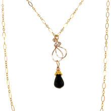 Faceted black spinel drop with a 14 karat gold filled chain measuring 18 inches. Finished with a 14 karat gold filled lobster clasp.