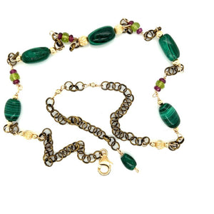 Malachite, rhodolite Garnet, peridot with gold accents. measuring 21 inches with a 3 inch extender.