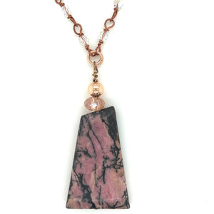 22 inch Rhodonite and crystal handmade chain is sure to please. It has a Rhodonite pendant drop with a handmade wire wrapped crystal and copper chain.