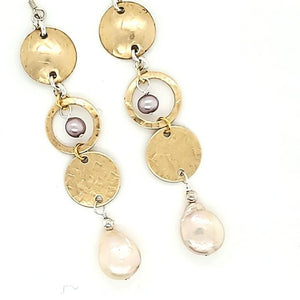 Drop Earring With Textured Brass Circles And Soft Coin Pearls.